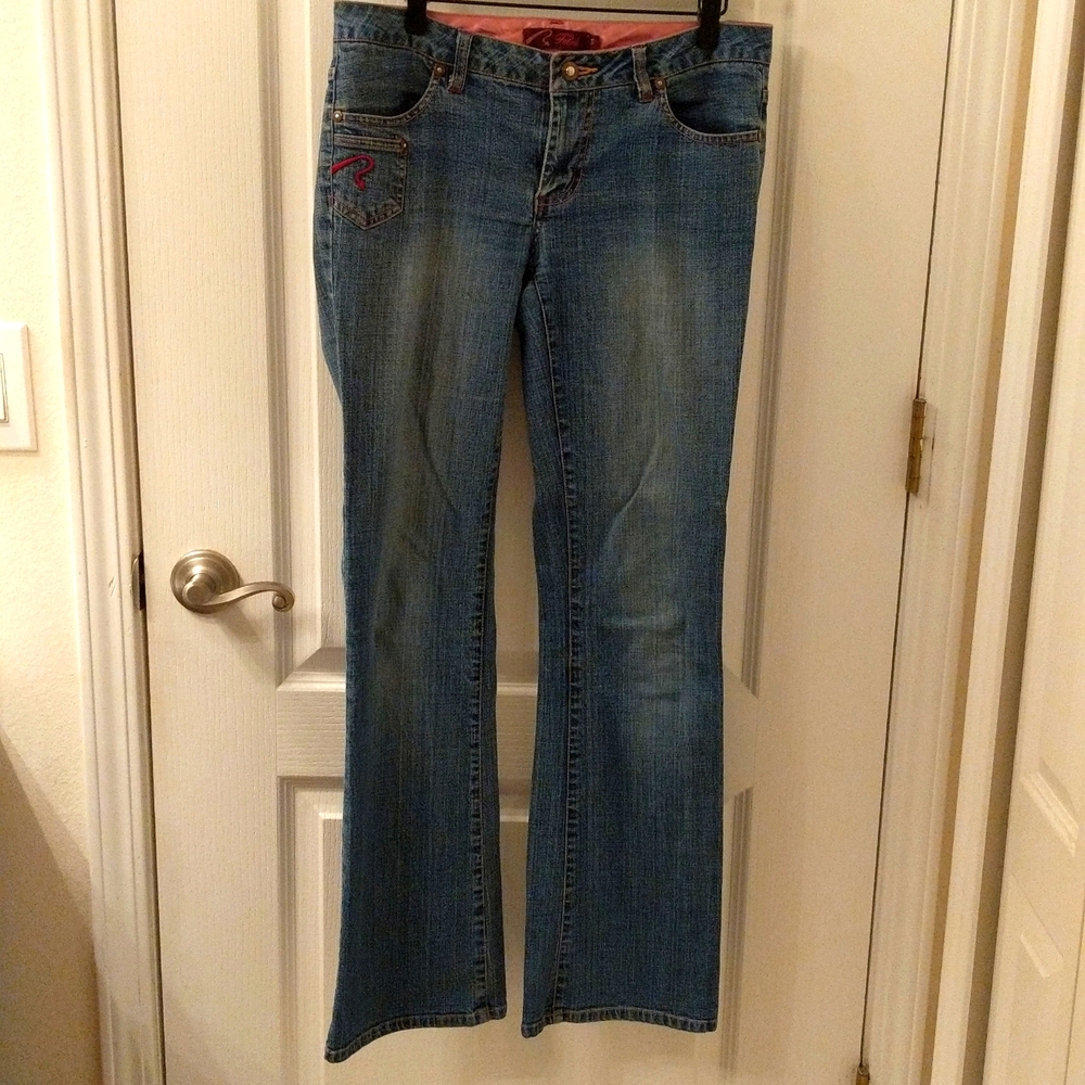 Fetish jeans, size 7/8 with pink detailing around pockets